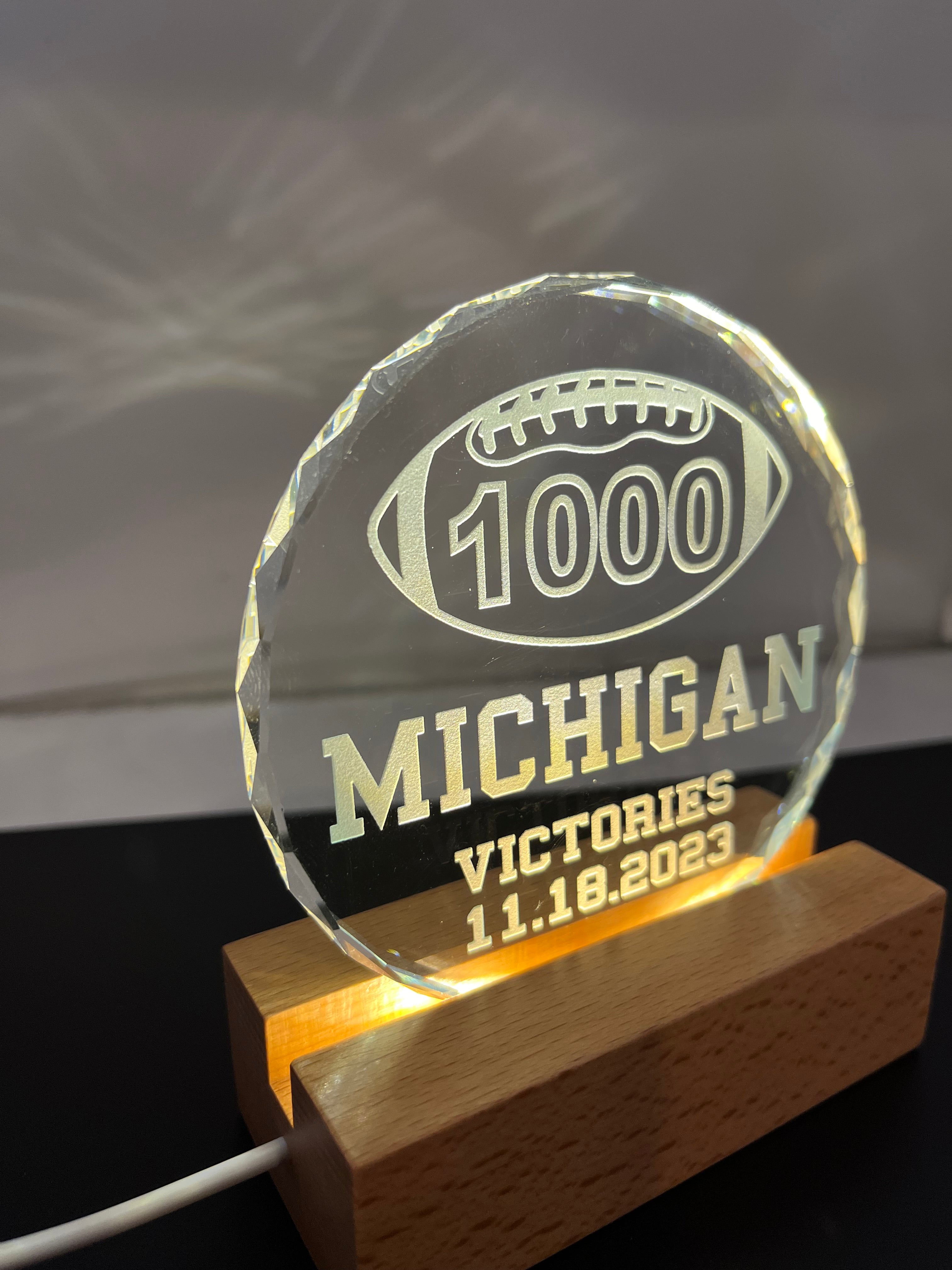 Michigan UM football 1st first to 1000 victories wins crystal lighted base memory celebration
